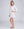 Side View: White Midi Beach Shirt with Perforated Cut Out Design