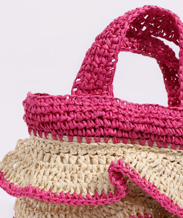 Close Up View: Sand and Hot Pink Woven Straw Bag with Ruffle Detail