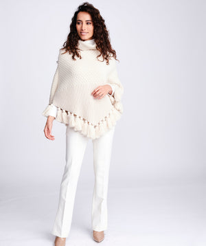 Cream Knitted Poncho with Tassel Trimmed Hemline and Roll Neck Collar